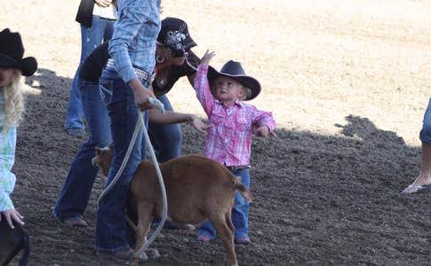 young child and goat